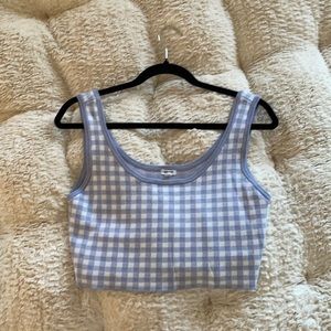 This blue and white top is from Garage and size medium.